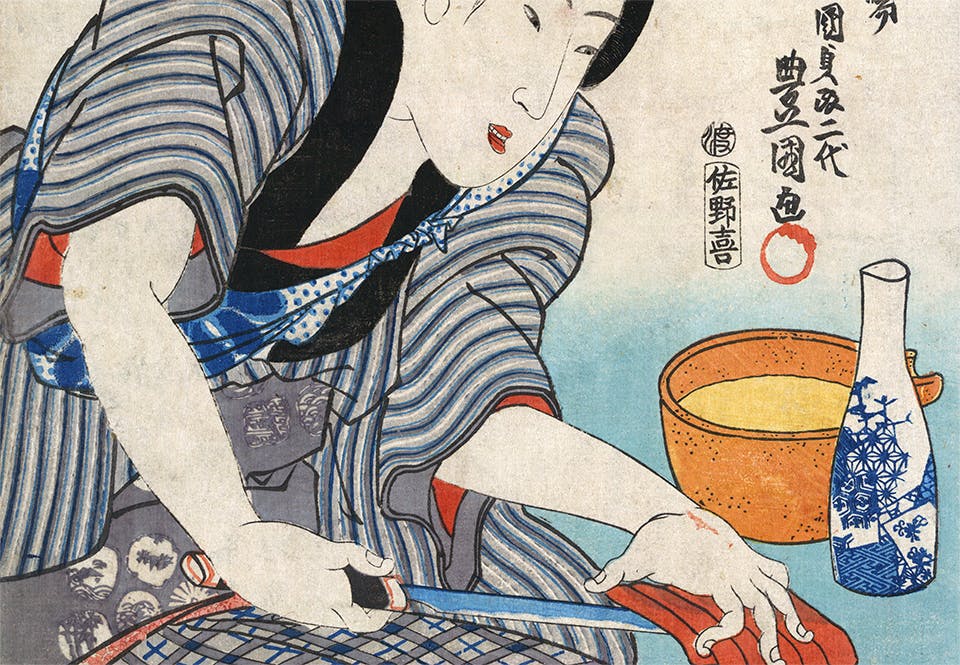 sushi snabbmat historia En kvinna bereder sashimi